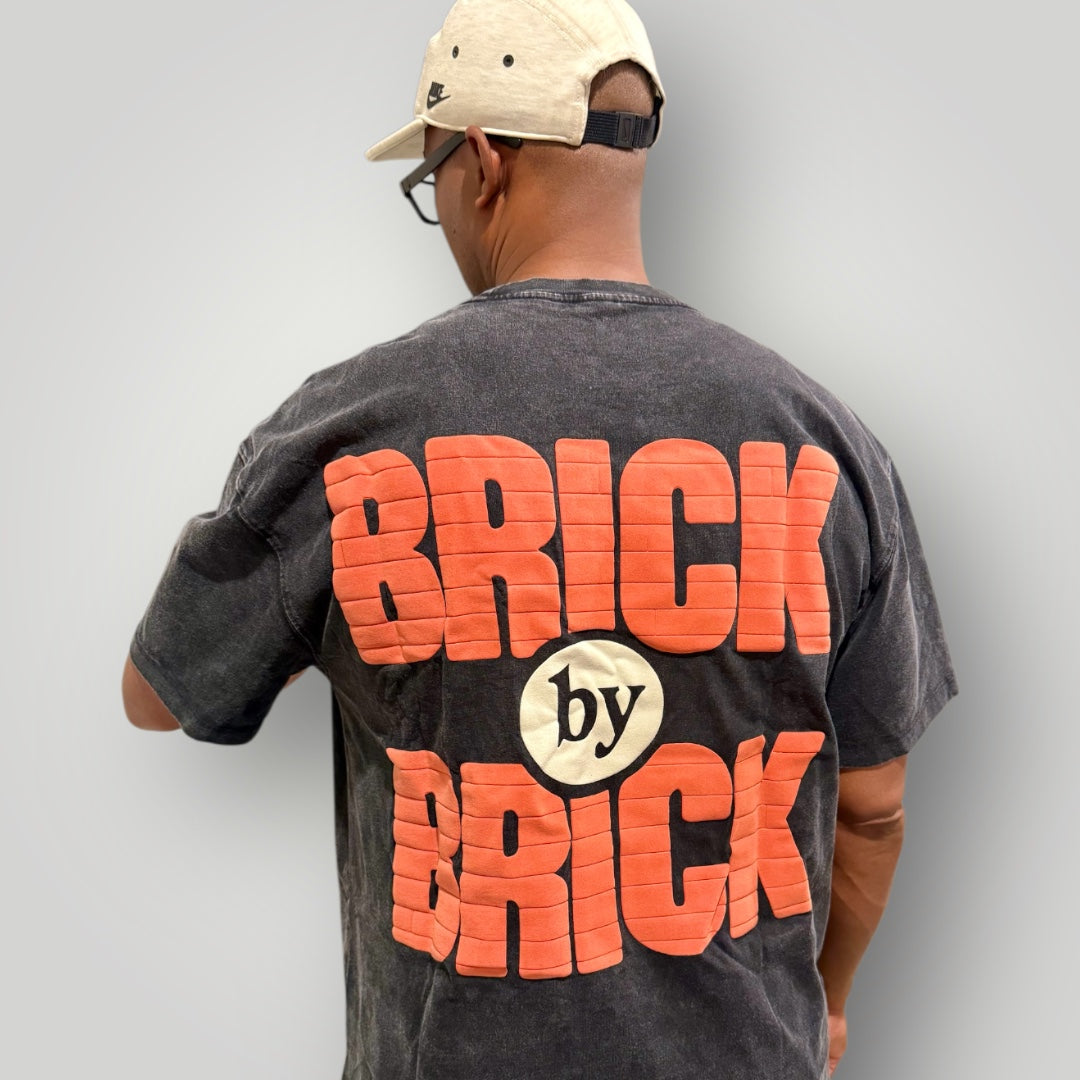 BRICK-by-BRICK – Built Not Given Tee