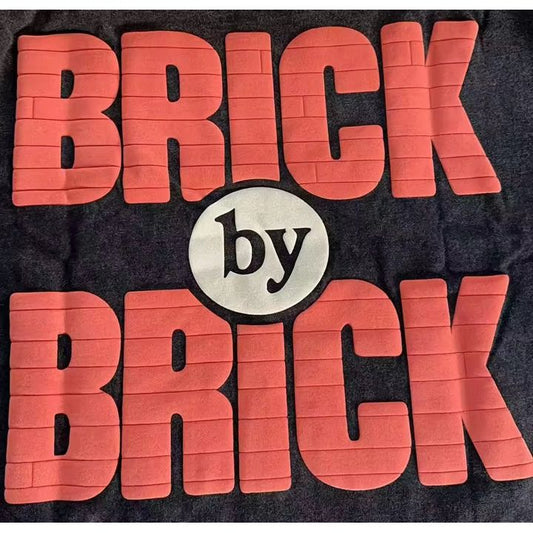 BRICK-by-BRICK – Built Not Given Tee
